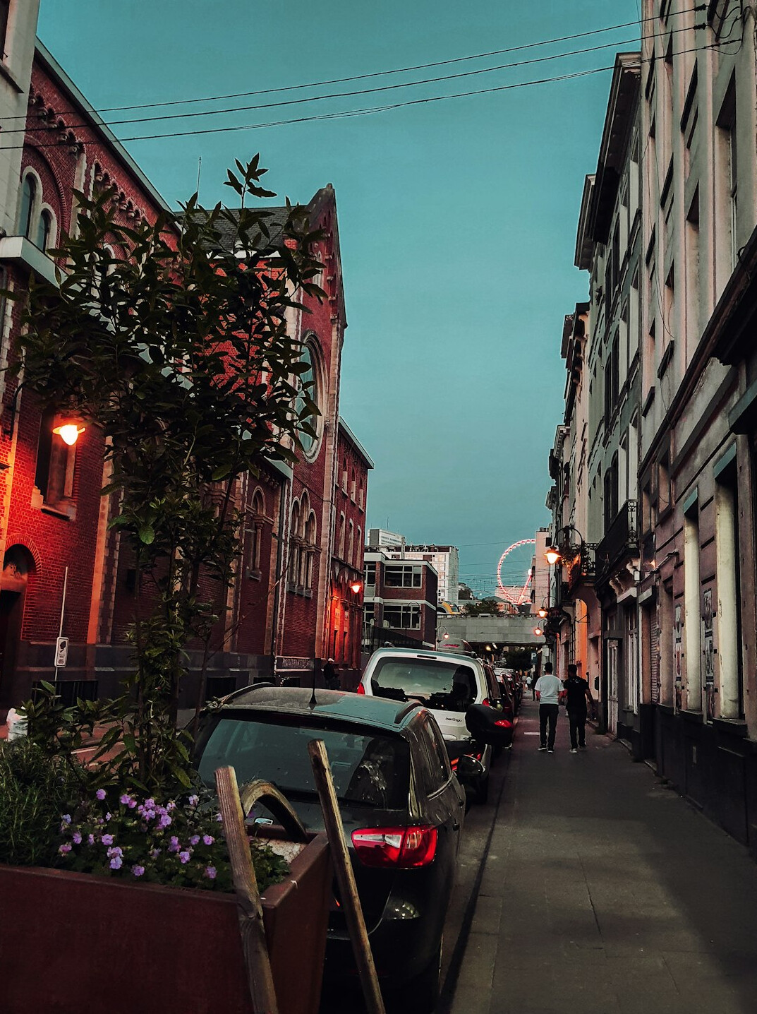 Car parked in a city street at dusk