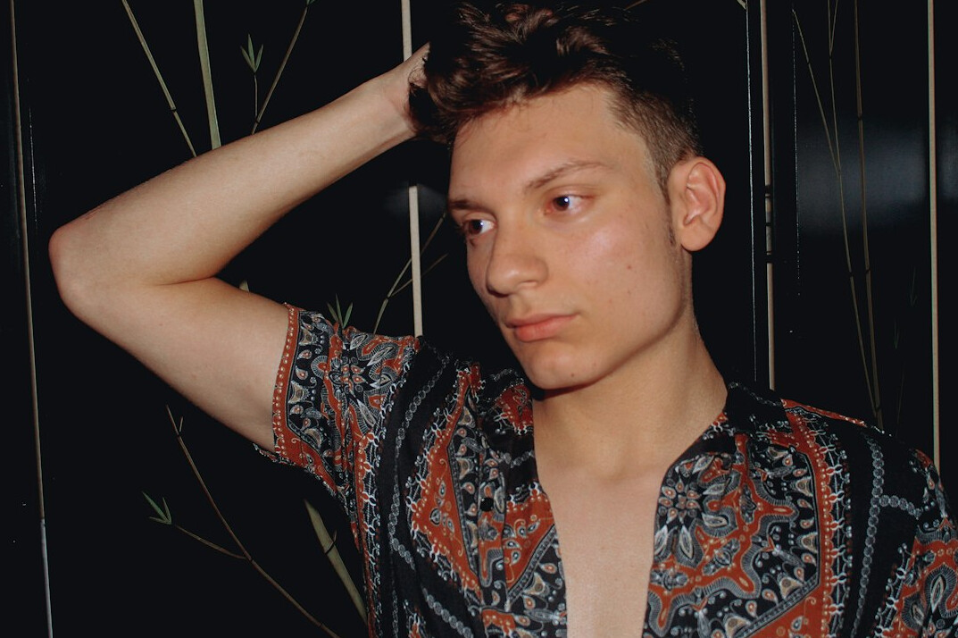 Portrait of a young man with short hair in a shirt
