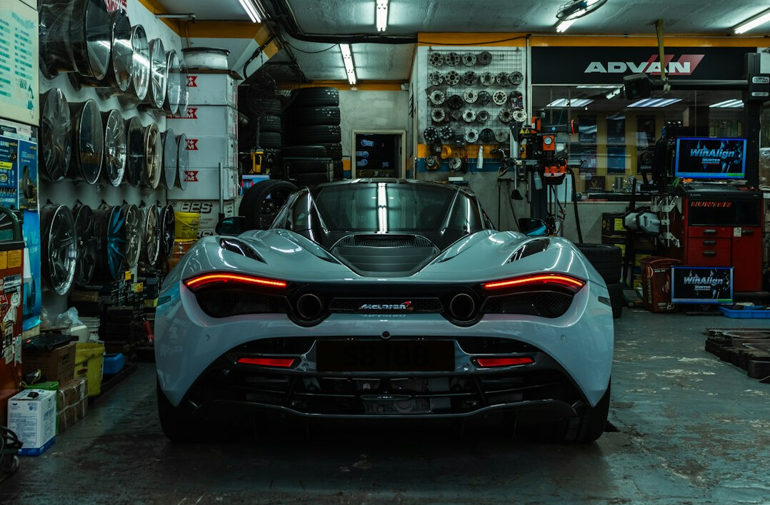 Car in a garage workshop being inspected
